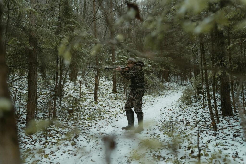 a man hunting in the forest